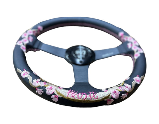 Speedzone Performance LLC SPDZ1 Sakura steering wheel, full view showing black and red design with textured grip for racing cars.