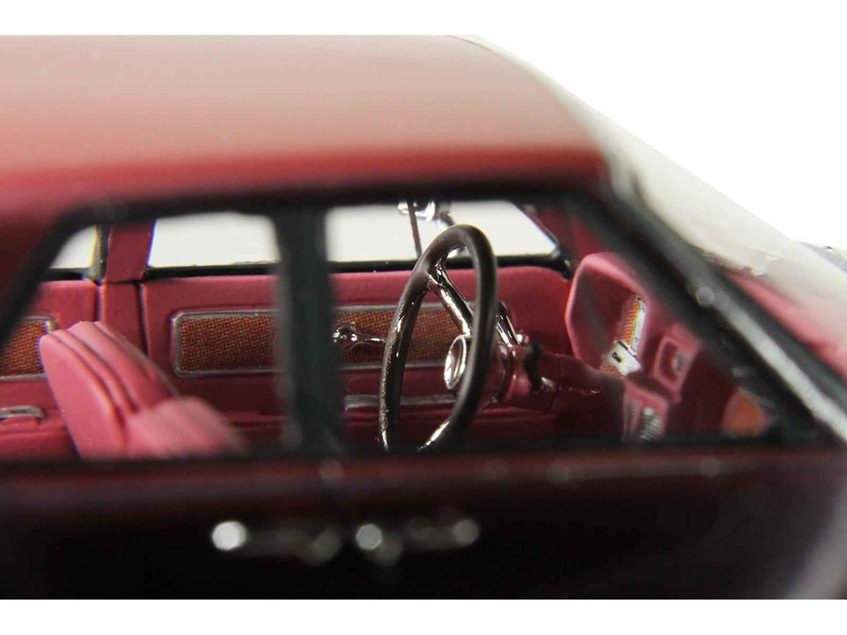 Miniature 1962 Lincoln Continental Royal Red Metallic model car by Miniature Motors, limited edition 1/43 scale with red interior.