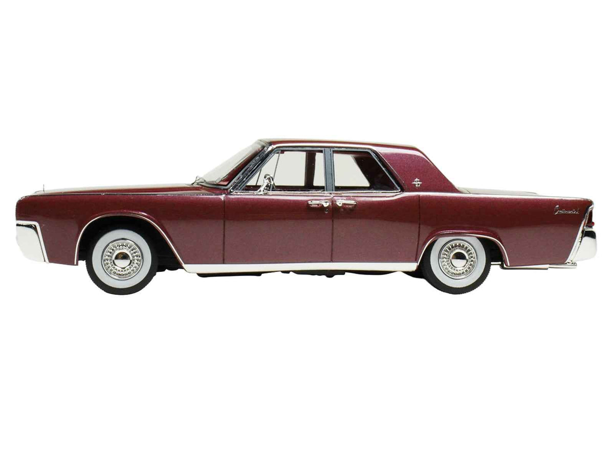Miniature 1962 Lincoln Continental Royal Red metallic model car by Goldvarg Collection, limited edition 1/43 scale with red interior.