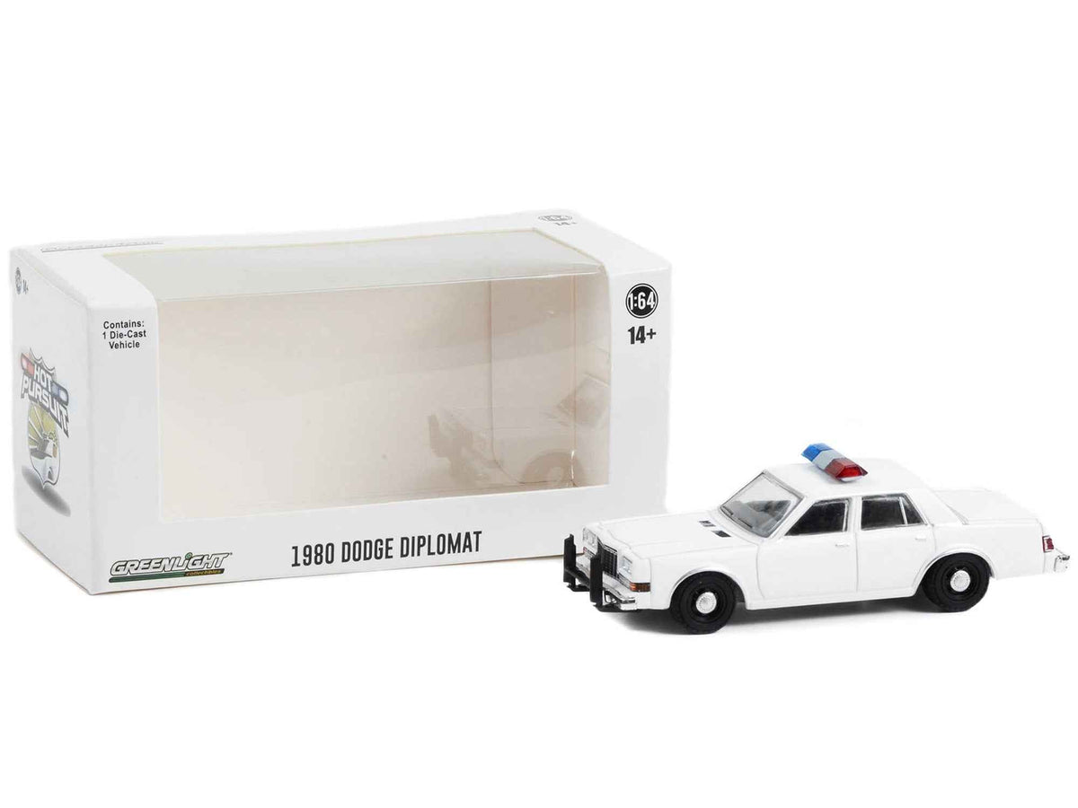 White 1980s Dodge Diplomat police unmarked diecast model car by Greenlight, featuring light bar and "Hot Pursuit" decal, 1/64 scale.