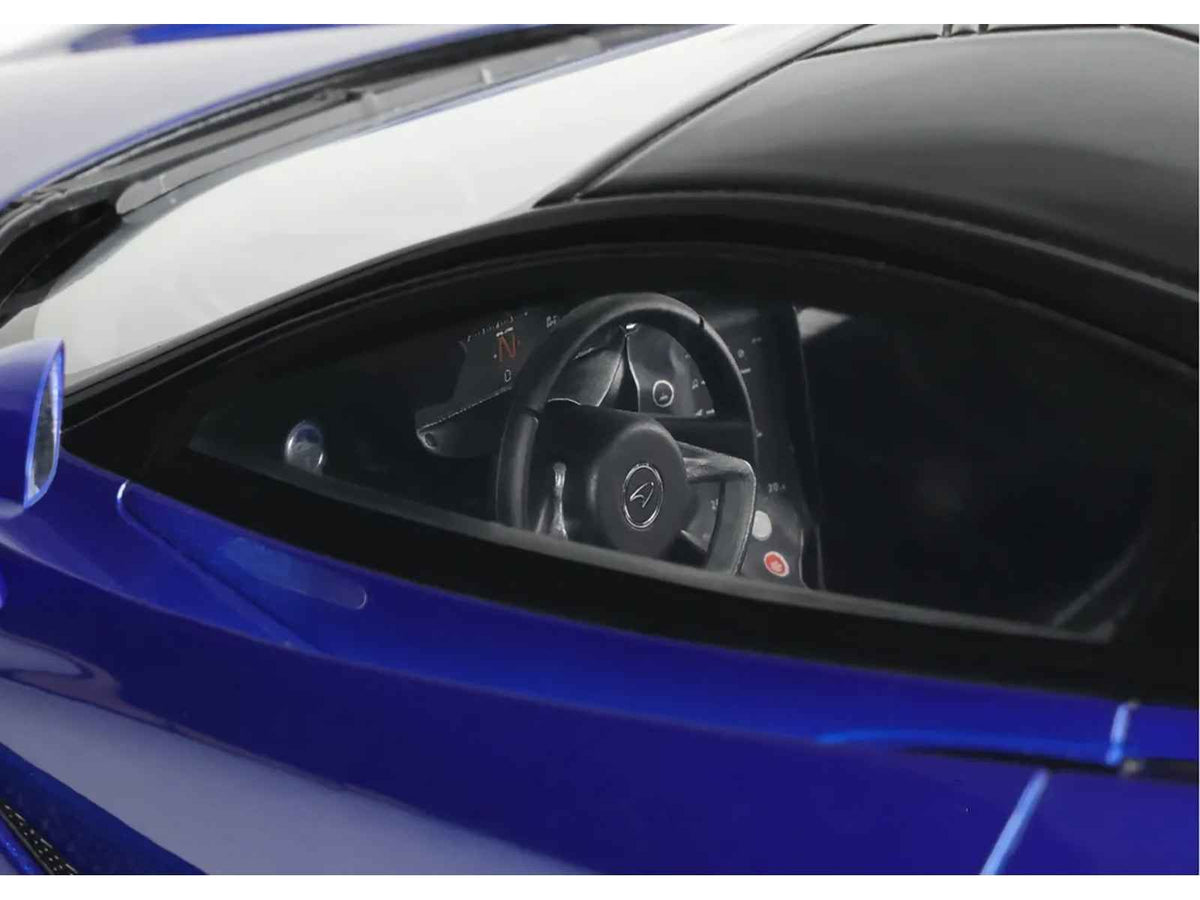 Miniature Motors 2023 McLaren 750S Coupe model car in blue metallic with black top, detailed 1/18 scale replica by GT Spirit.