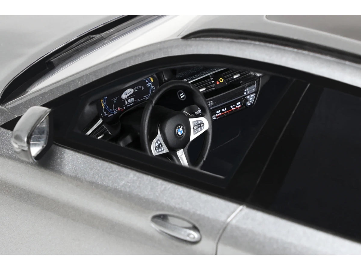 Silver metallic 2023 BMW 530e xDrive M model car by GT Spirit, detailed 1/18 scale miniature from BMW models collection.