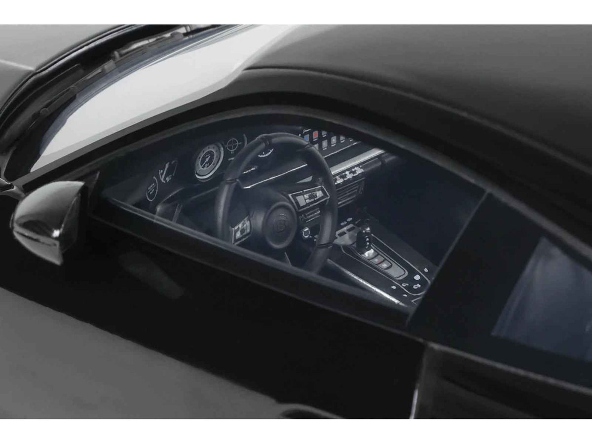 2023 Brabus 900 Rocket-R Black 1/18 scale model car by GT Spirit, detailed miniature vehicle with sleek black finish.