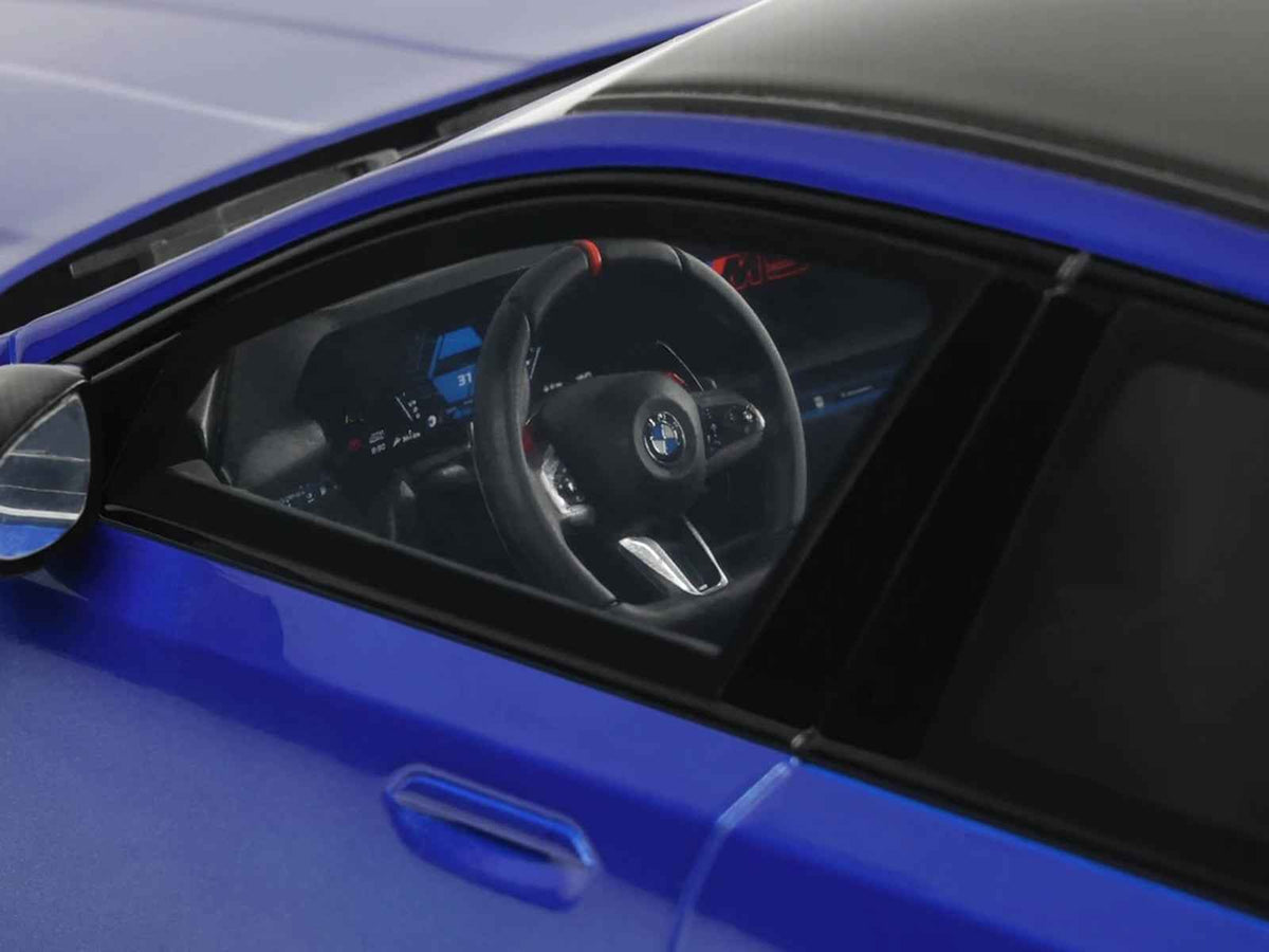2024 BMW M5 G90 Marina Bay Blue Metallic miniature model car by GT Spirit, with black roof, detailed 1/18 scale display.