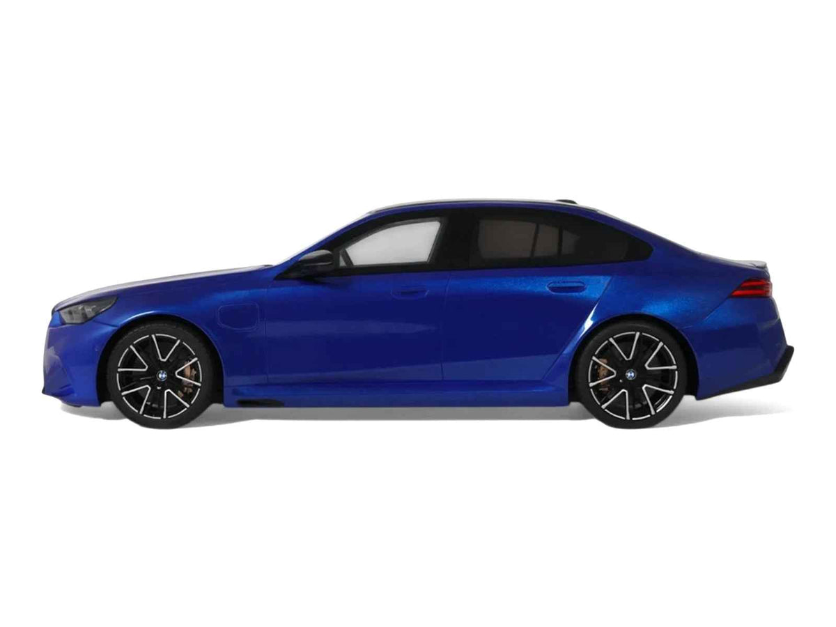 Miniature 1/18 BMW M5 G90 model car in Marina Bay Blue Metallic with black roof by GT Spirit, detailed automotive collectible.