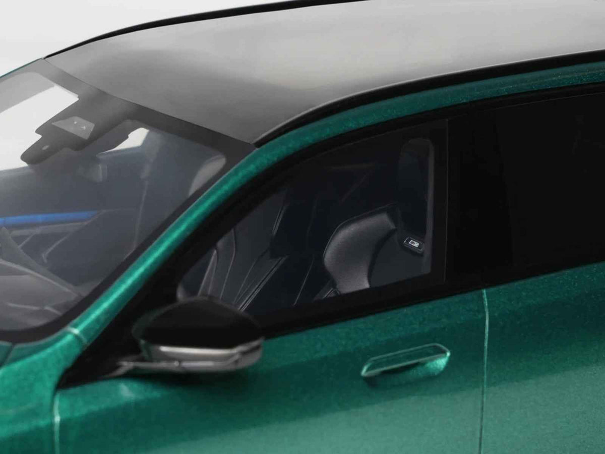 Miniature 1/18 BMW M5 Touring G99 model car in Isle of Man Green Metallic with black roof by GT Spirit.