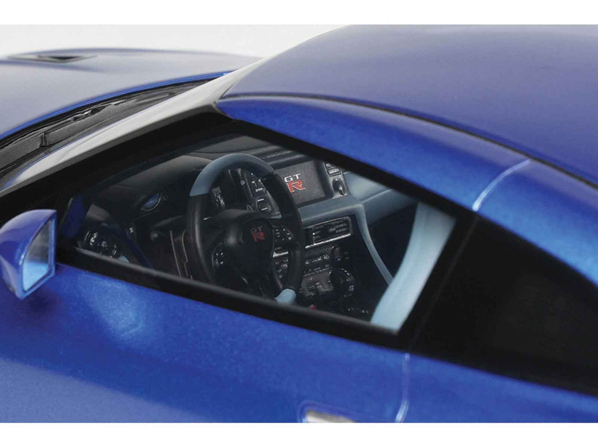 Miniature Nissan GT-R Skyline Edition 1/18 model car in Bayside Blue Metallic by GT Spirit, detailed collectible vehicle.