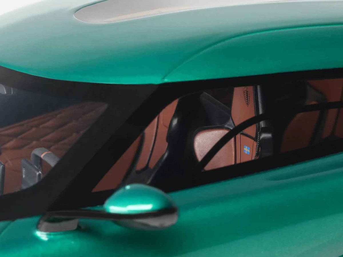 2024 Koenigsegg Gemera racing green metallic 1/18 scale model car by GT Spirit, detailed miniature automotive collectible.