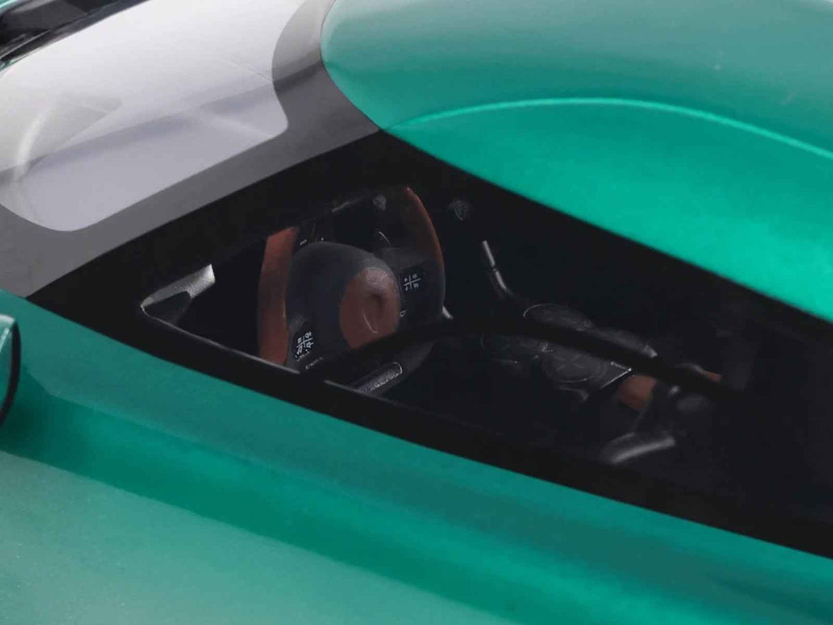 2024 Koenigsegg Gemera racing green metallic 1/18 scale model car by GT Spirit, detailed miniature of the luxury sports vehicle.