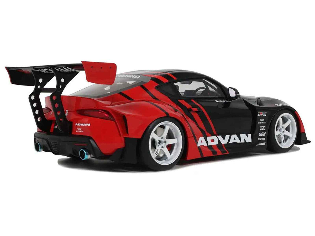 Black and red 1/18 scale Toyota Supra GR RHD model car by GT Spirit, detailed miniature replica from Miniature Motors.