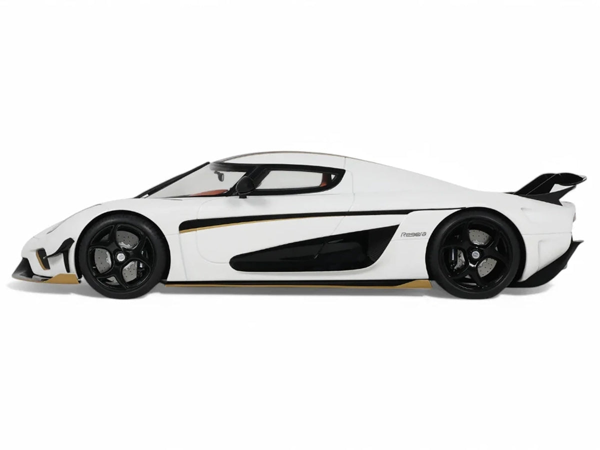 2023 Koenigsegg Regera 1/18 scale model car with white body and black stripes by GT Spirit, detailed miniature collectible.