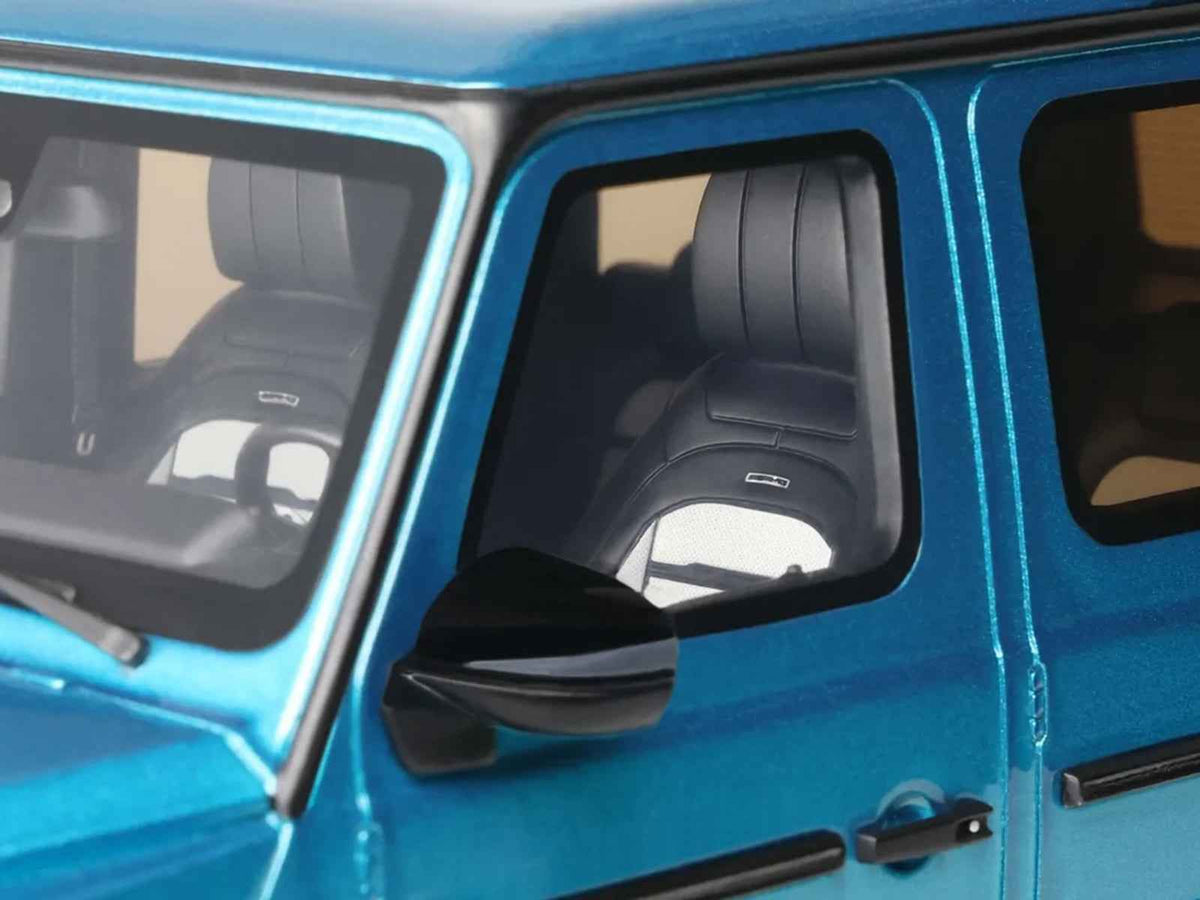 Detailed 1/18 scale Mercedes-Benz G 63 AMG model car in Hyper Blue Magno Metallic by GT Spirit, showcasing realistic features.