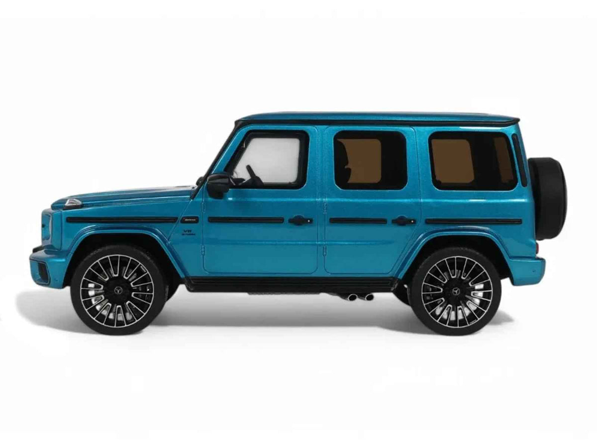 Miniature 1/18 Mercedes-Benz G 63 AMG model car in Hyper Blue Magno Metallic by GT Spirit, detailed close-up view.