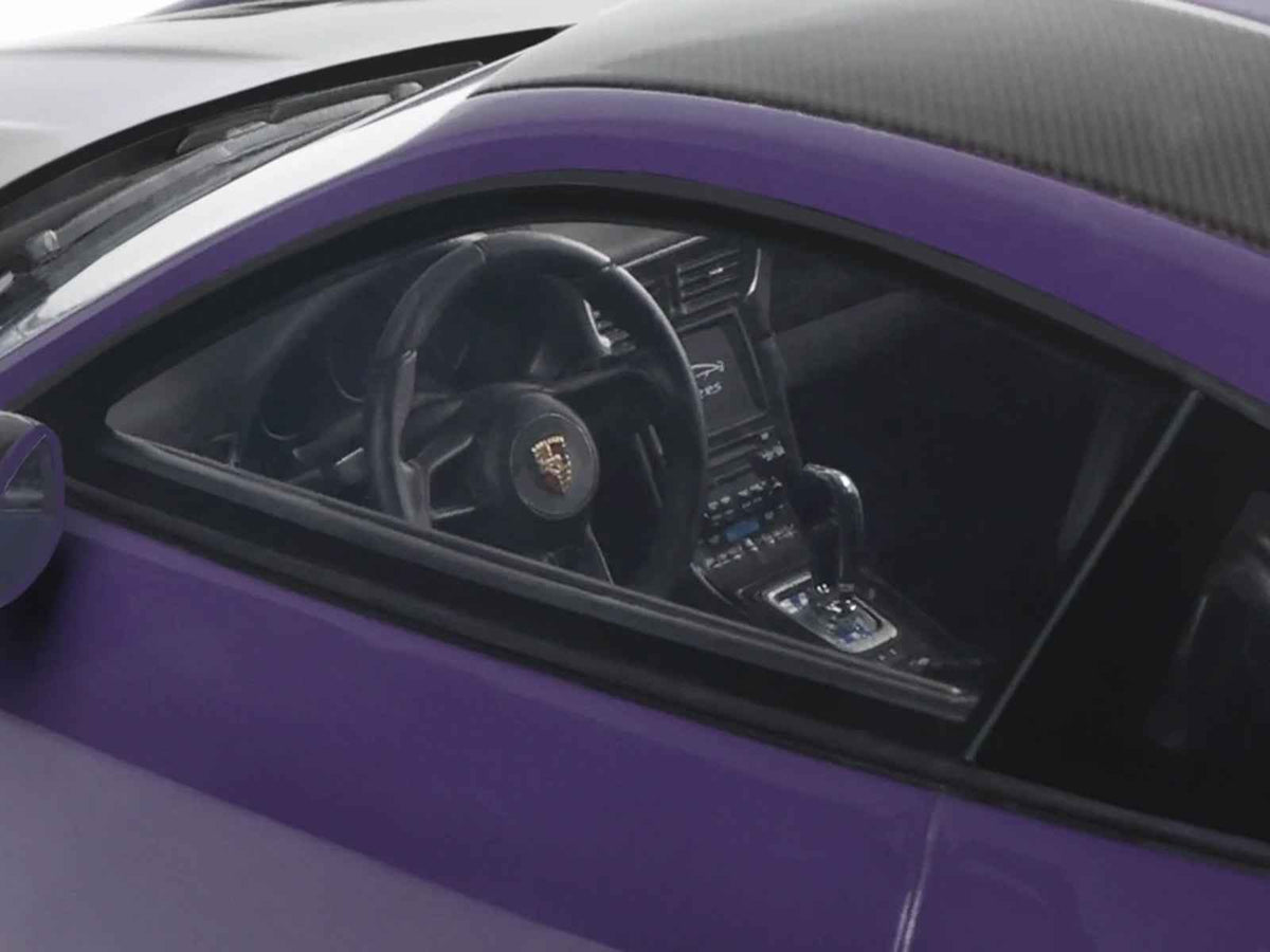 Miniature 1/18 Porsche 911 (991.2) GT2 RS model car in ultraviolet metallic with carbon stripe details by GT Spirit.