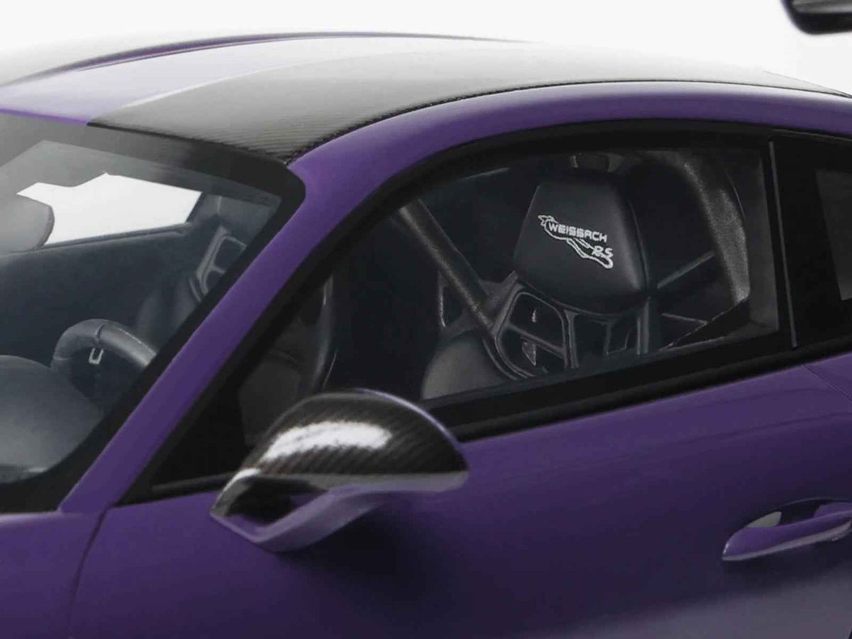 Miniature Porsche 911 (991.2) GT2 RS model car in Ultraviolet Metallic with carbon stripe detailing, by GT Spirit.