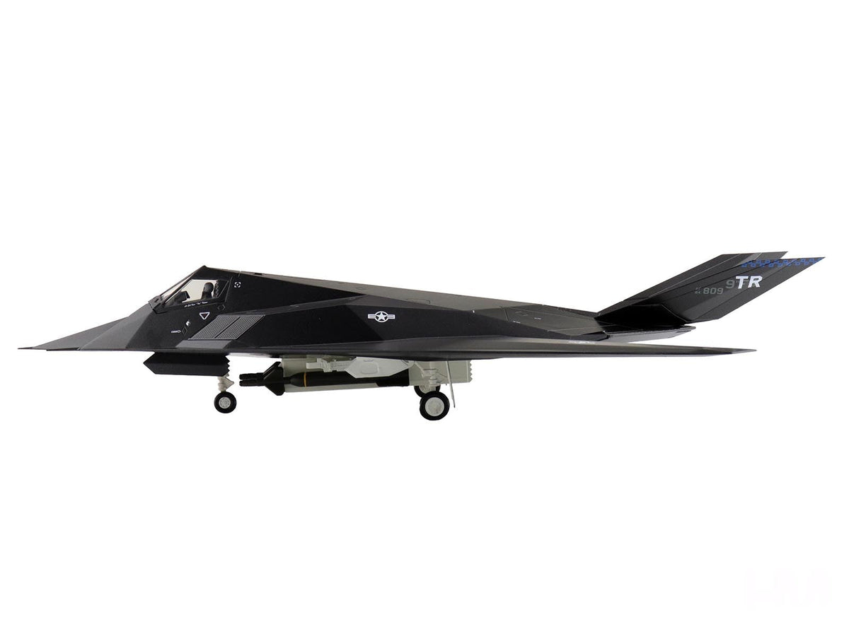 Lockheed F-117A Nighthawk stealth aircraft diecast model in 1/72 scale by Hobby Master, showing aircraft details and markings.