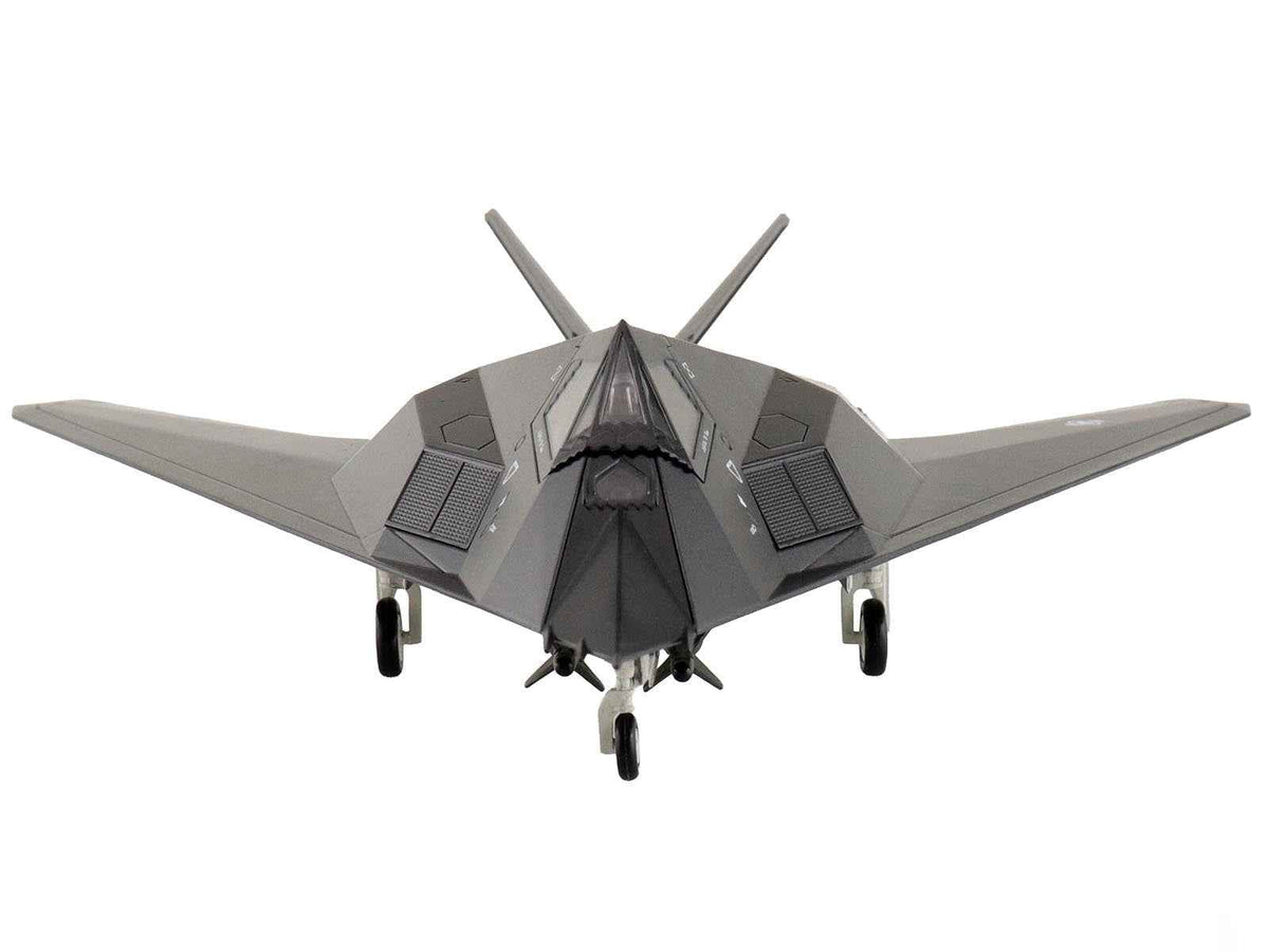Lockheed Martin F-117A Nighthawk stealth aircraft diecast model by Miniature Motors, United States Air Force, 1/72 scale.