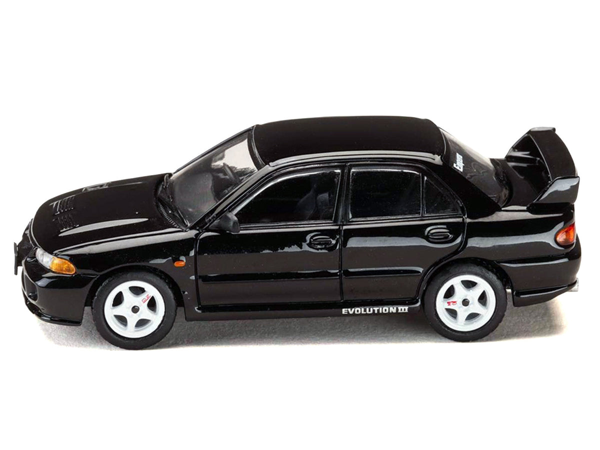 Black Mitsubishi Lancer RS Evolution III RHD diecast model car by Miniature Motors, from the Diorama Set Series, detailed 1/64 scale.