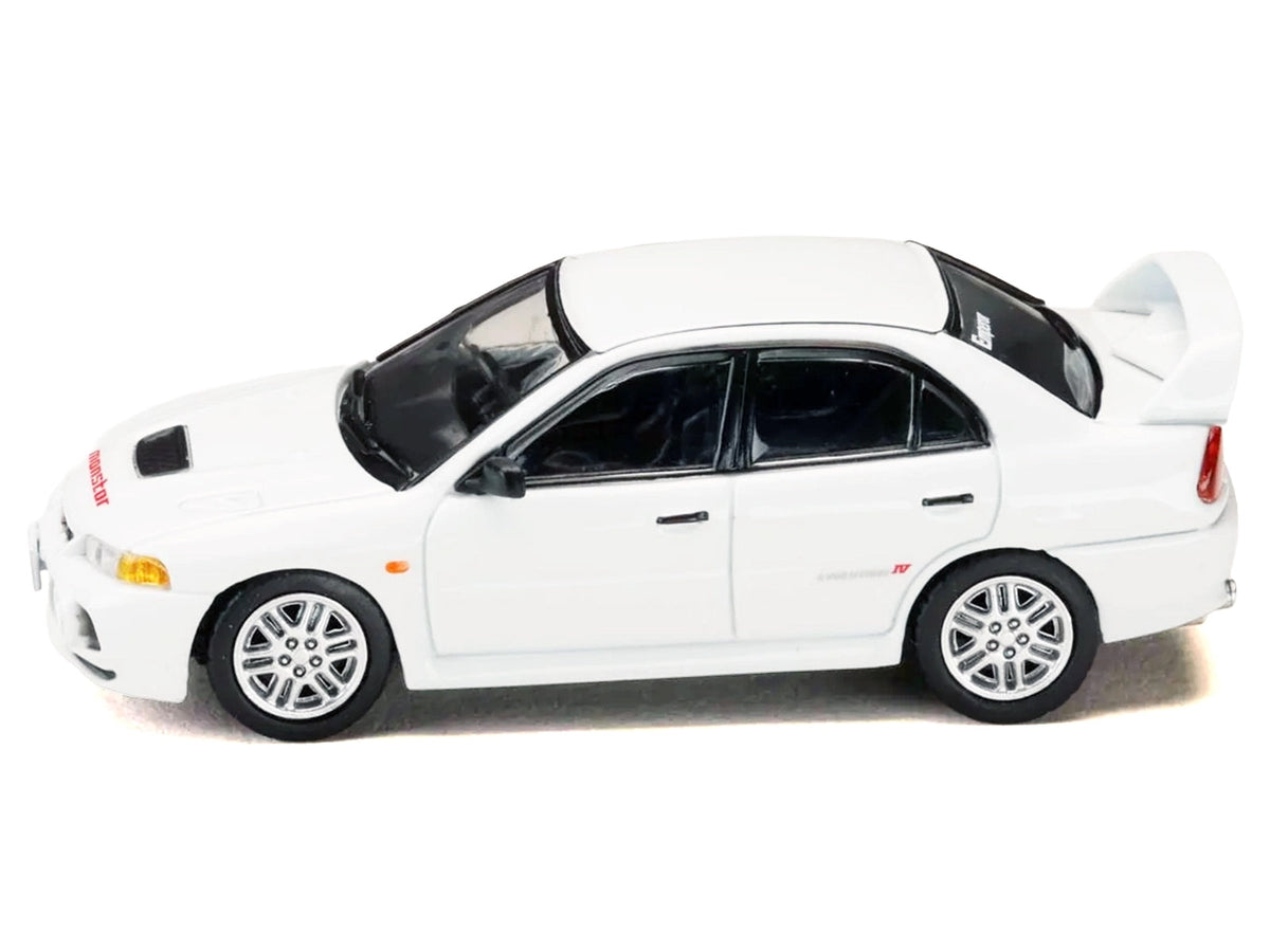 White Mitsubishi Lancer RS Evolution IV RHD diecast model car from Miniature Motors' Diorama Set Series, inspired by Initial D manga.