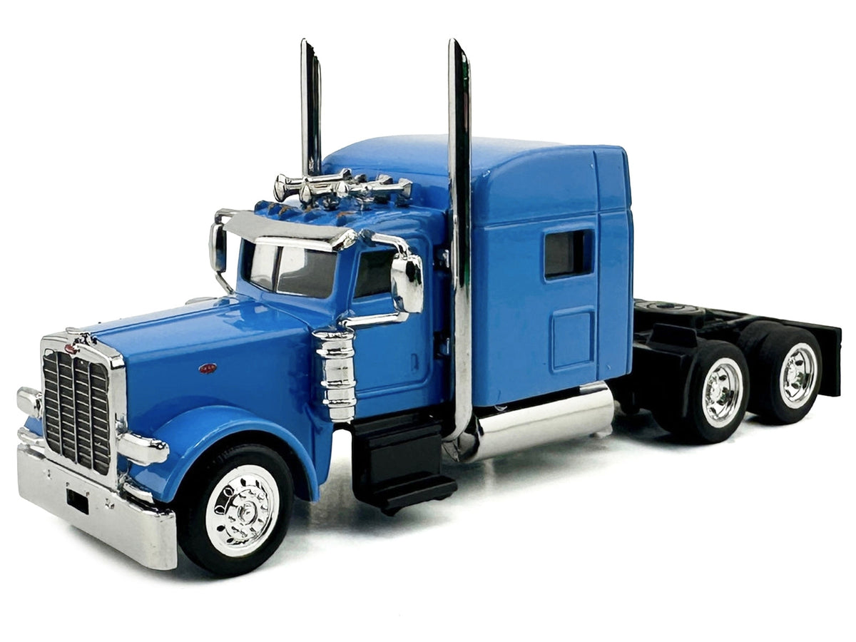 Miniature Baby Blue Peterbilt 389 truck tractor with sleeper cab model in 1/87 scale by Miniature Motors.
