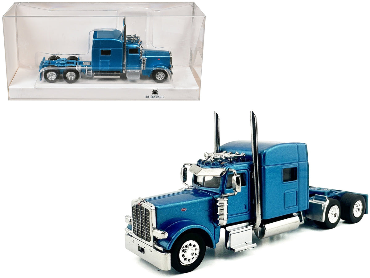 Blue metallic Peterbilt 389 truck tractor with sleeper cab, 1/87 scale plastic model by Miniature Motors, detailed HO Logistics replica.