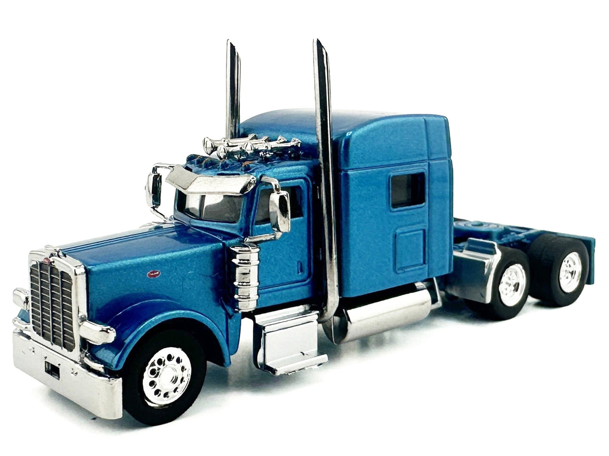 Blue metallic Peterbilt 389 truck tractor with sleeper cab, 1/87 scale plastic model by Miniature Motors, detailed HO Logistics replica