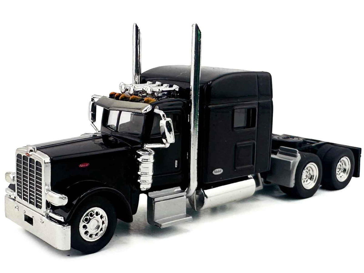 Black Peterbilt 389 truck tractor with sleeper cab miniature model by Miniature Motors, detailed HO scale plastic vehicle.