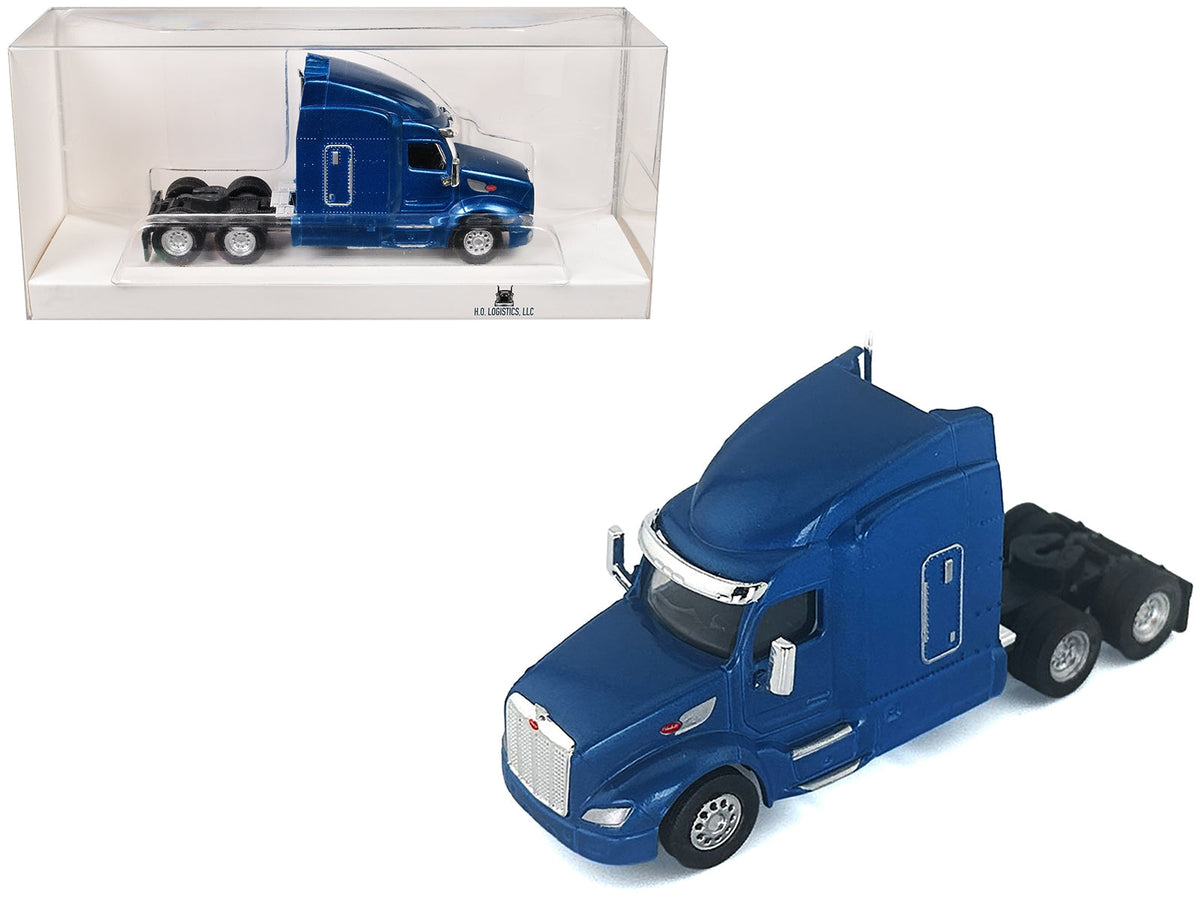 Blue metallic Peterbilt 579 sleeper cab model in 1/87 scale by Miniature Motors, detailed plastic model car for collectors.