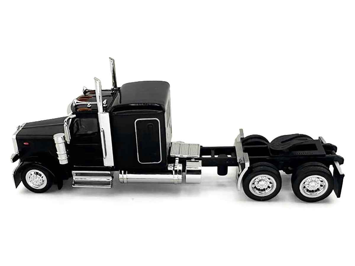 Black Peterbilt 589 truck model with 72-inch sleeper, miniature HO scale by Miniature Motors, detailed plastic model car.