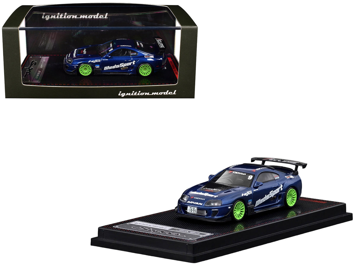 Blue metallic Toyota Supra (JZA80) RZ diecast model car with graphics, by Ignition Model, featuring WedsSport branding and RHD details.