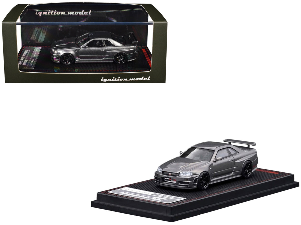Gray metallic Nissan Skyline GT-R BNR34 Nismo CRS 1/64 diecast model car by Ignition Model, RHD with detailed features.