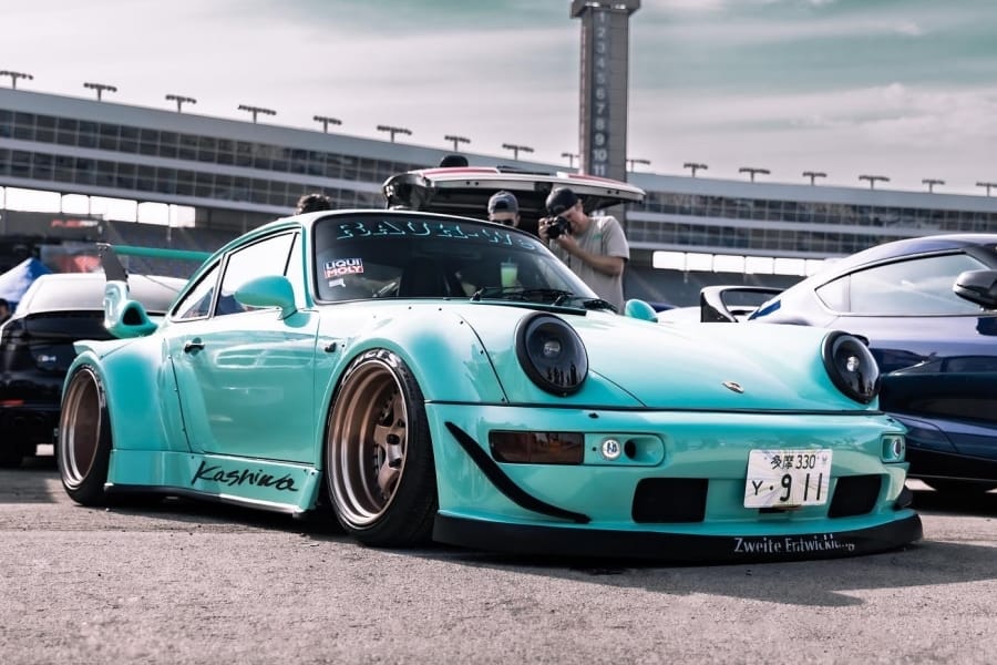 Tiffany Blue Porsche 964 RWB diecast car by Lot57Supplies, 1:64 scale, detailed miniature vehicle on display.