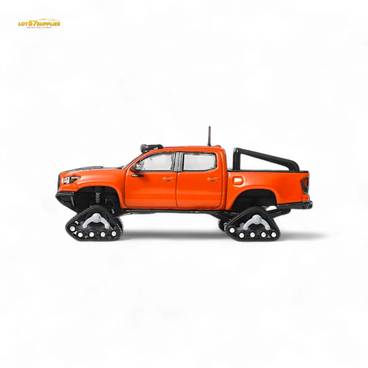 Toyota Tacoma diecast model with orange-red GCD 3PMSF tires, detailed miniature vehicle for display or collection.
