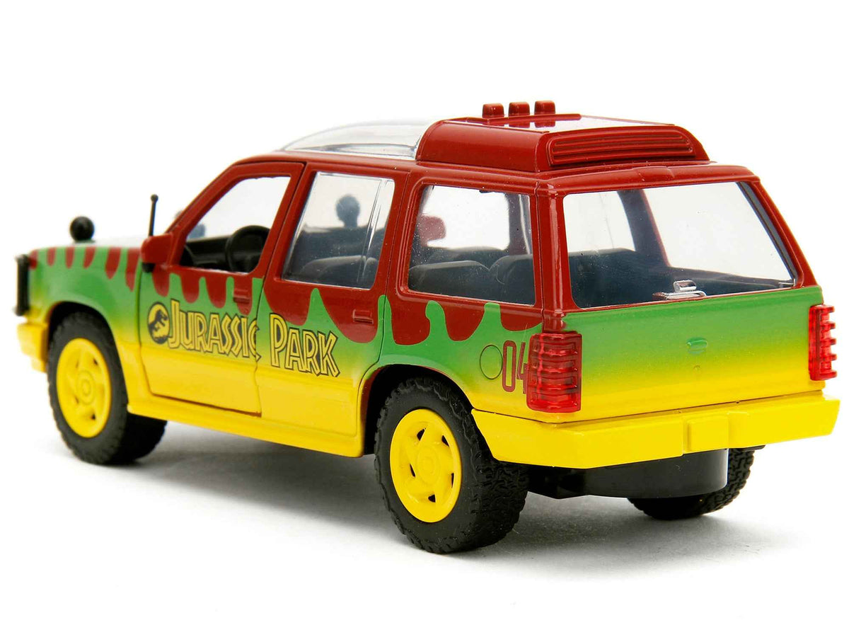 Red and yellow Ford Explorer Jurassic Park 30th Anniversary diecast model car by Jada, with green graphics, part of Hollywood Rides series.