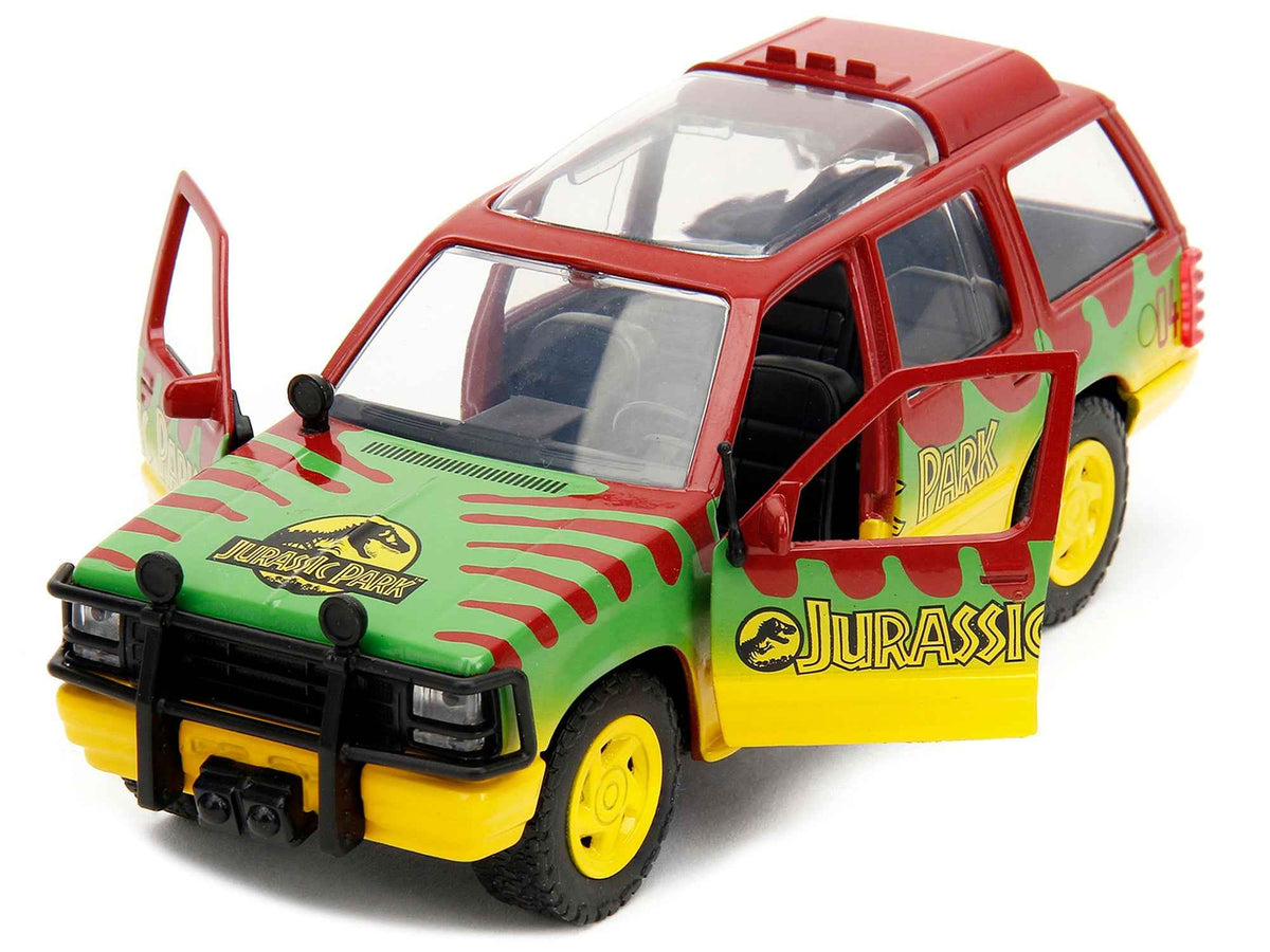 Red and yellow Ford Explorer Jurassic Park 1993 diecast model car by Jada from Hollywood Rides Series, featuring green graphics.