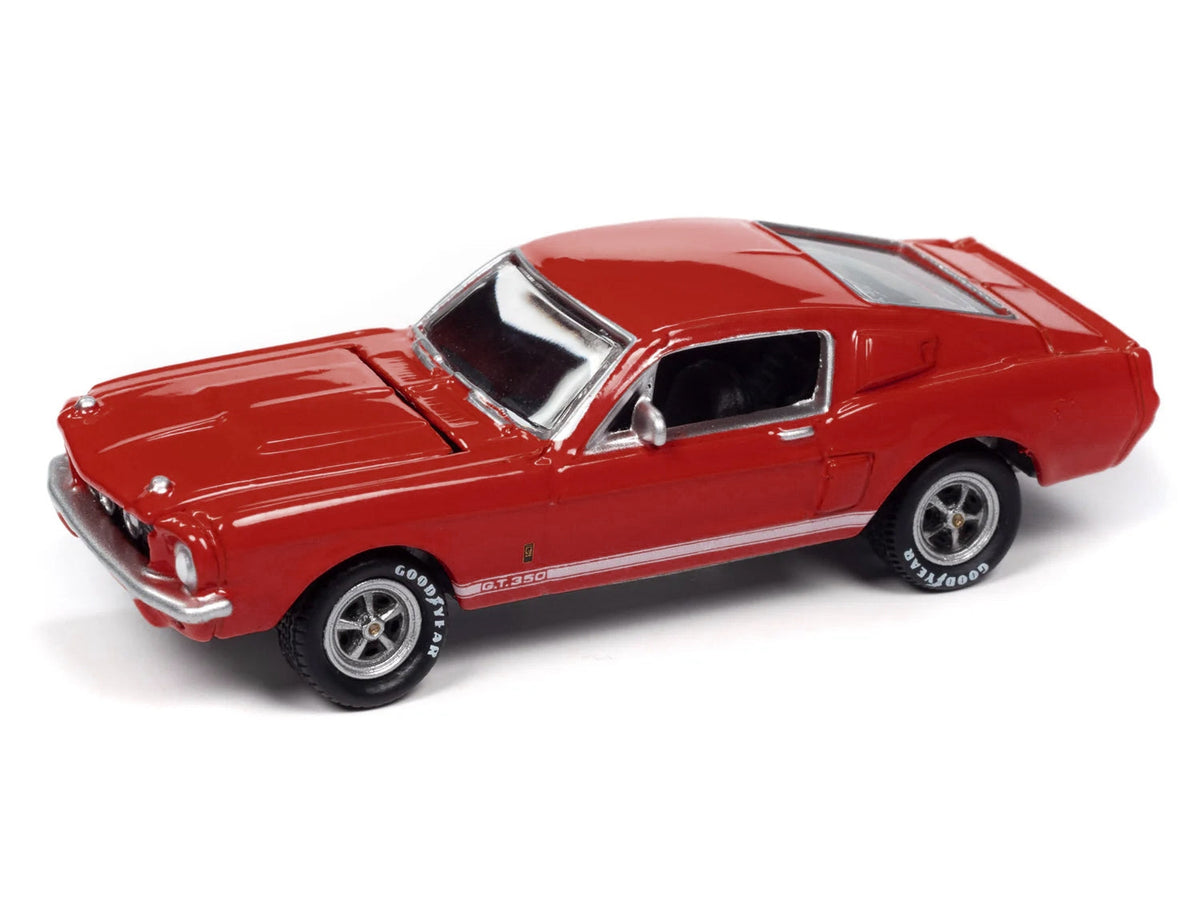 Red 1967 Shelby GT-350 diecast model car with white side stripes by Johnny Lightning, part of Miniature Motors Shelby Models collection.