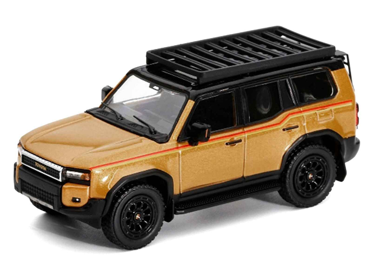 Miniature Motors 2024 Toyota Land Cruiser Prado diecast model in gold metallic with red stripes and roof rack, 1/64 scale.