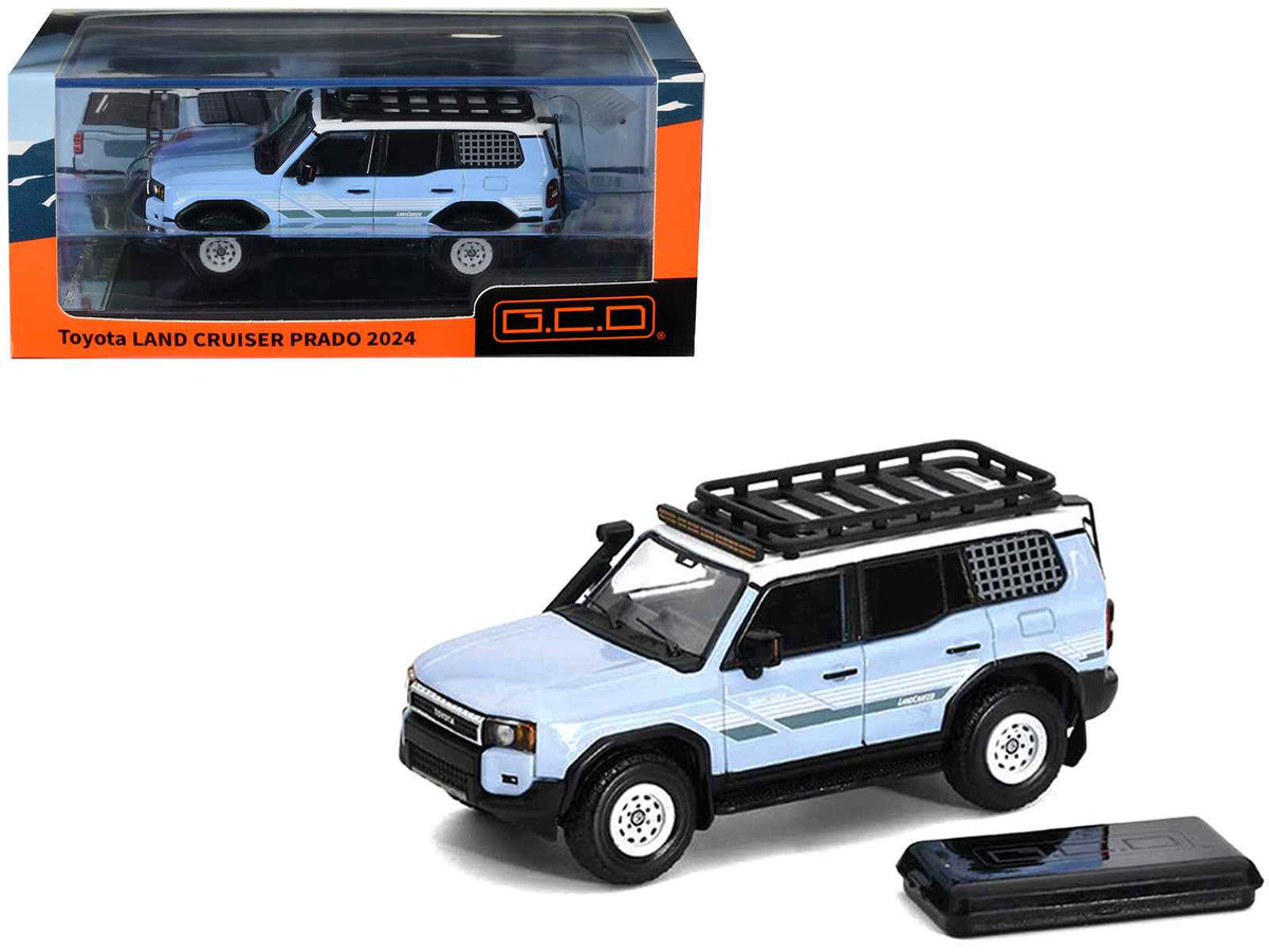 Miniature Motors 1/64 diecast model of 2024 Toyota Land Cruiser Prado in light blue with white top, stripes, roof rack, and accessories.