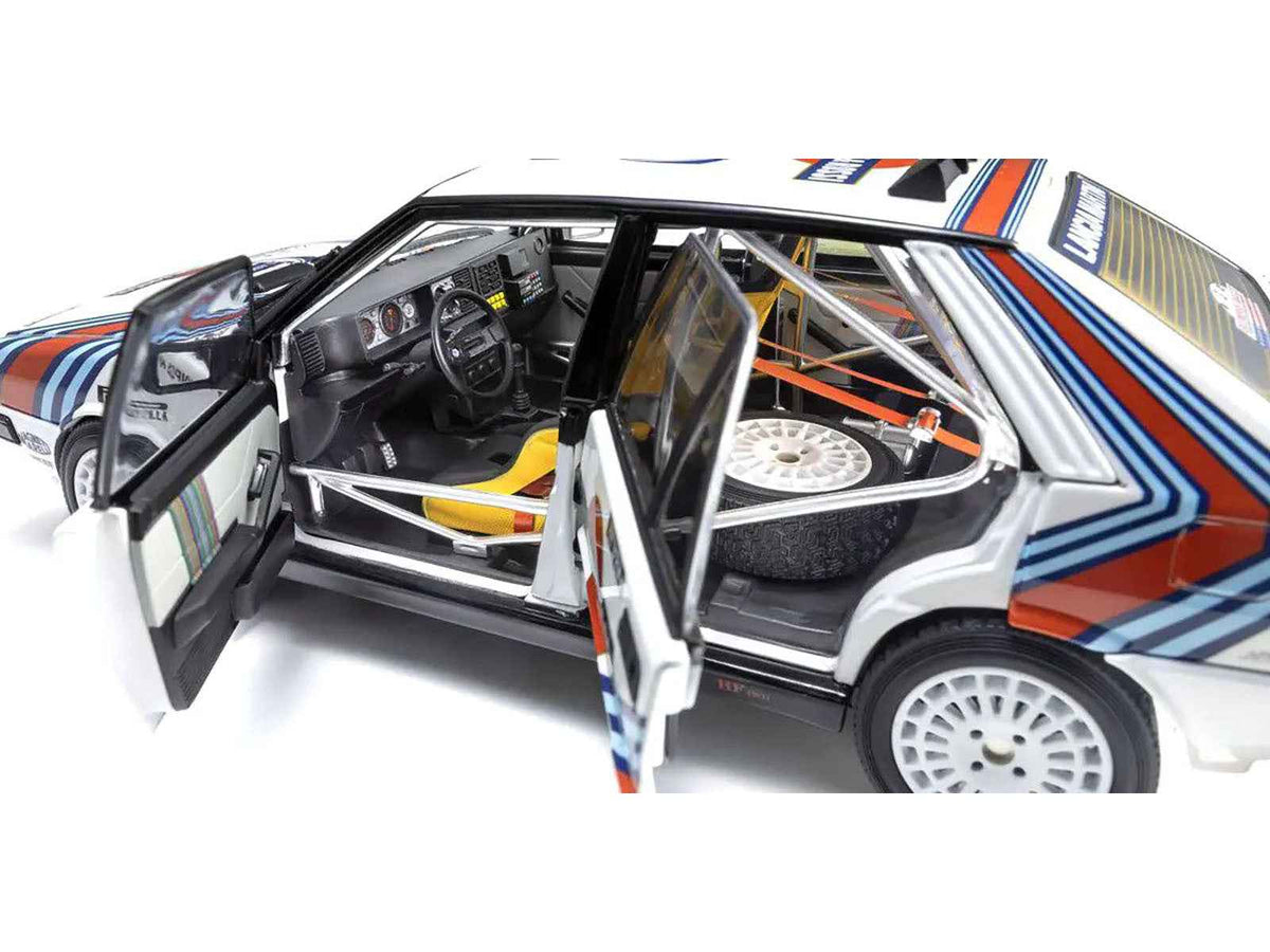 Miniature Motors 1/18 Lancia Delta HF 4WD Juha Kankkunen Olympus Rally diecast model car with Martini Racing livery.