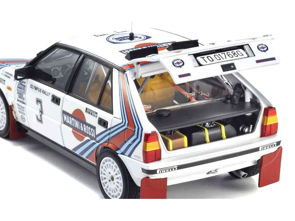 Miniature Motors 1/18 diecast Lancia Delta HF 4WD Juha Kankkunen Olympus Rally model car by Kyosho showing racing details and Martini livery.