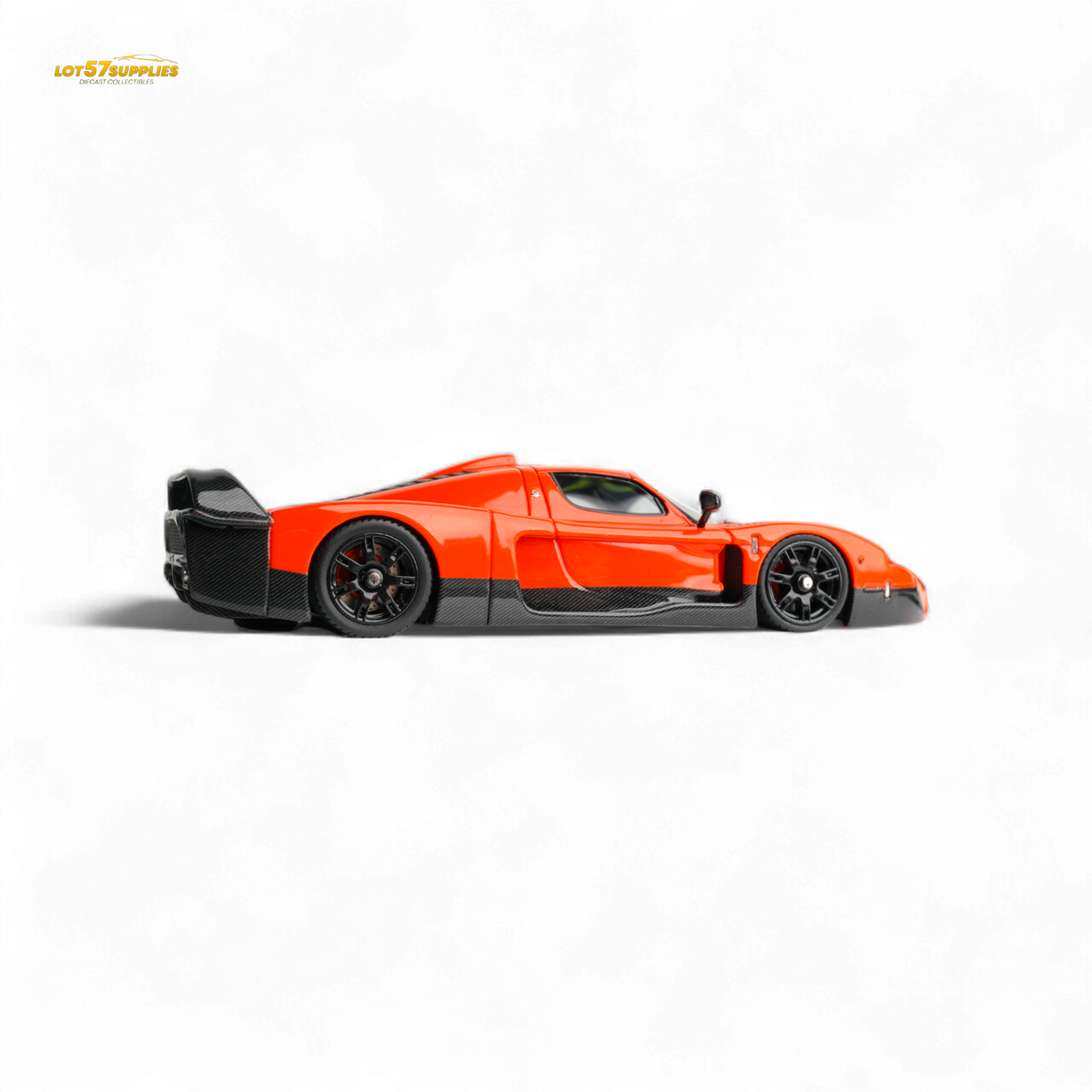 Yellow and orange diecast Maserati MC12 Stradale Corsa model in 1:64 scale, featuring detailed two-tone orange design.