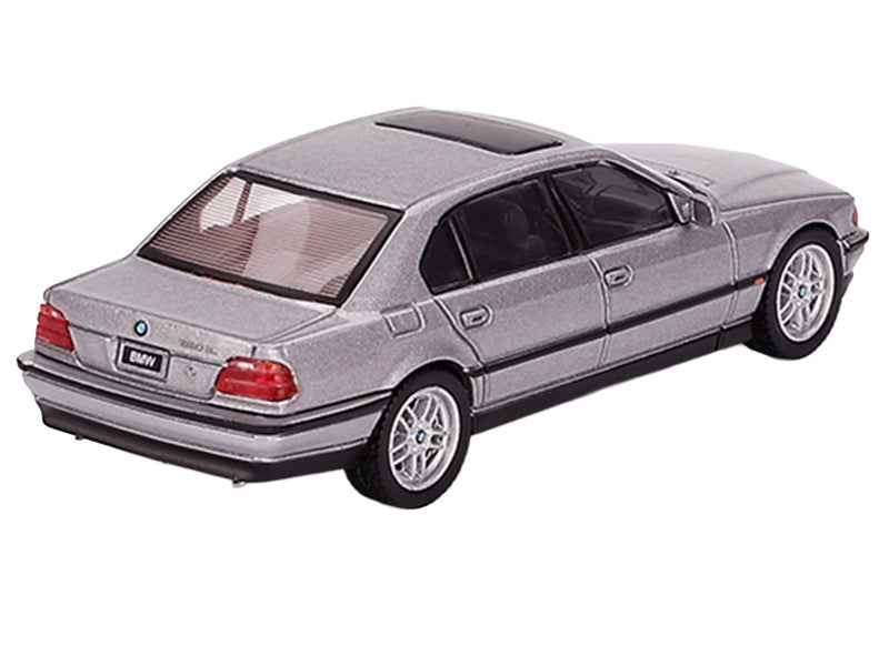 Mini GT BMW 750IL diecast model car in Aspen Silver Metallic with sunroof, limited edition 1/64 scale, detailed miniature vehicle.