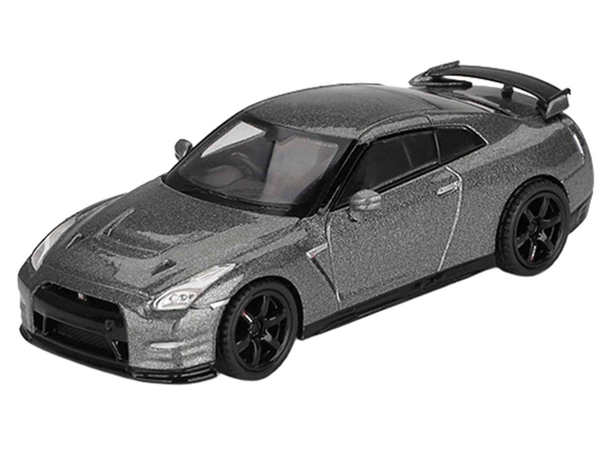 Dark metal gray Nissan GT-R Nismo R35 CRS diecast model car by Mini GT, right hand drive, limited edition 1/64 scale.