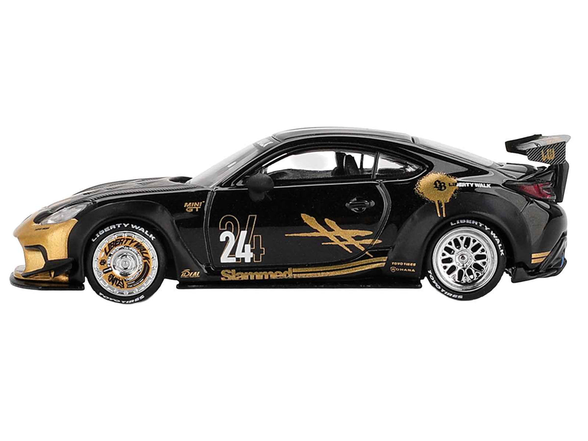 Toyota GR86 LB-Nation Liberty Walk 1/64 diecast model by Miniature Motors, black with carbon hood and gold graphics.