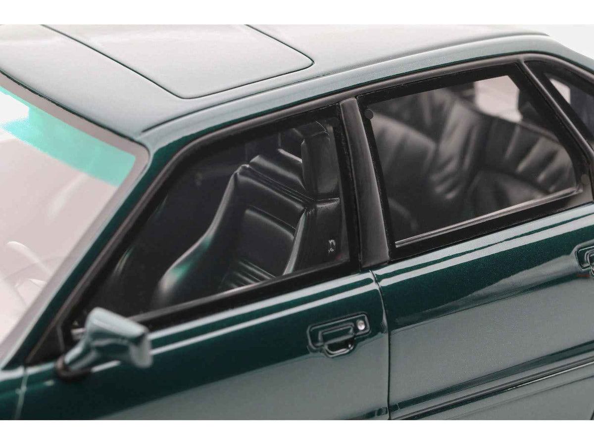Limited edition 1993 Audi S2 Sedan model car in emerald green metallic by Otto Mobile, 1/18 scale, collectible miniature.