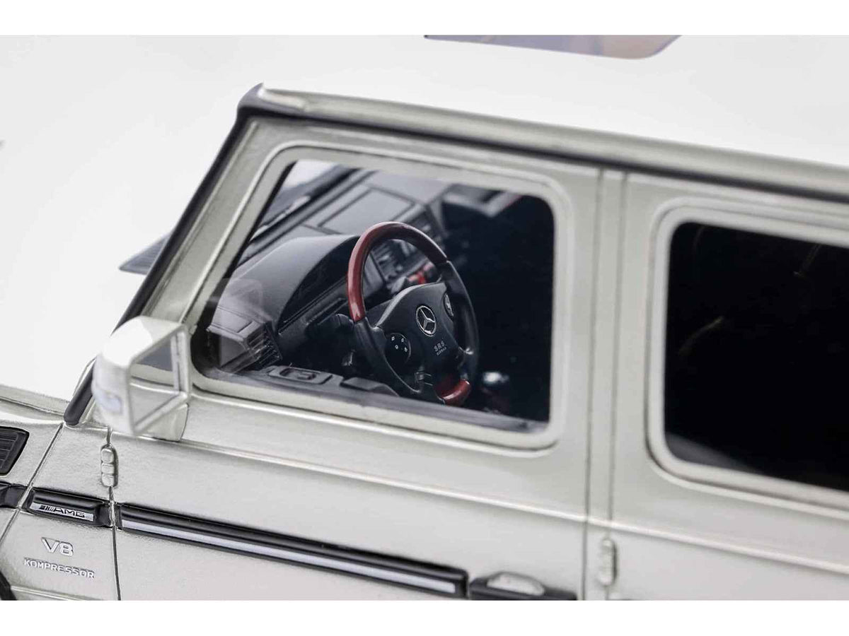Miniature Mercedes-Benz G-Class 55 AMG 1/18 model car in iridium silver metallic by Otto Mobile, limited edition of 999 pieces.