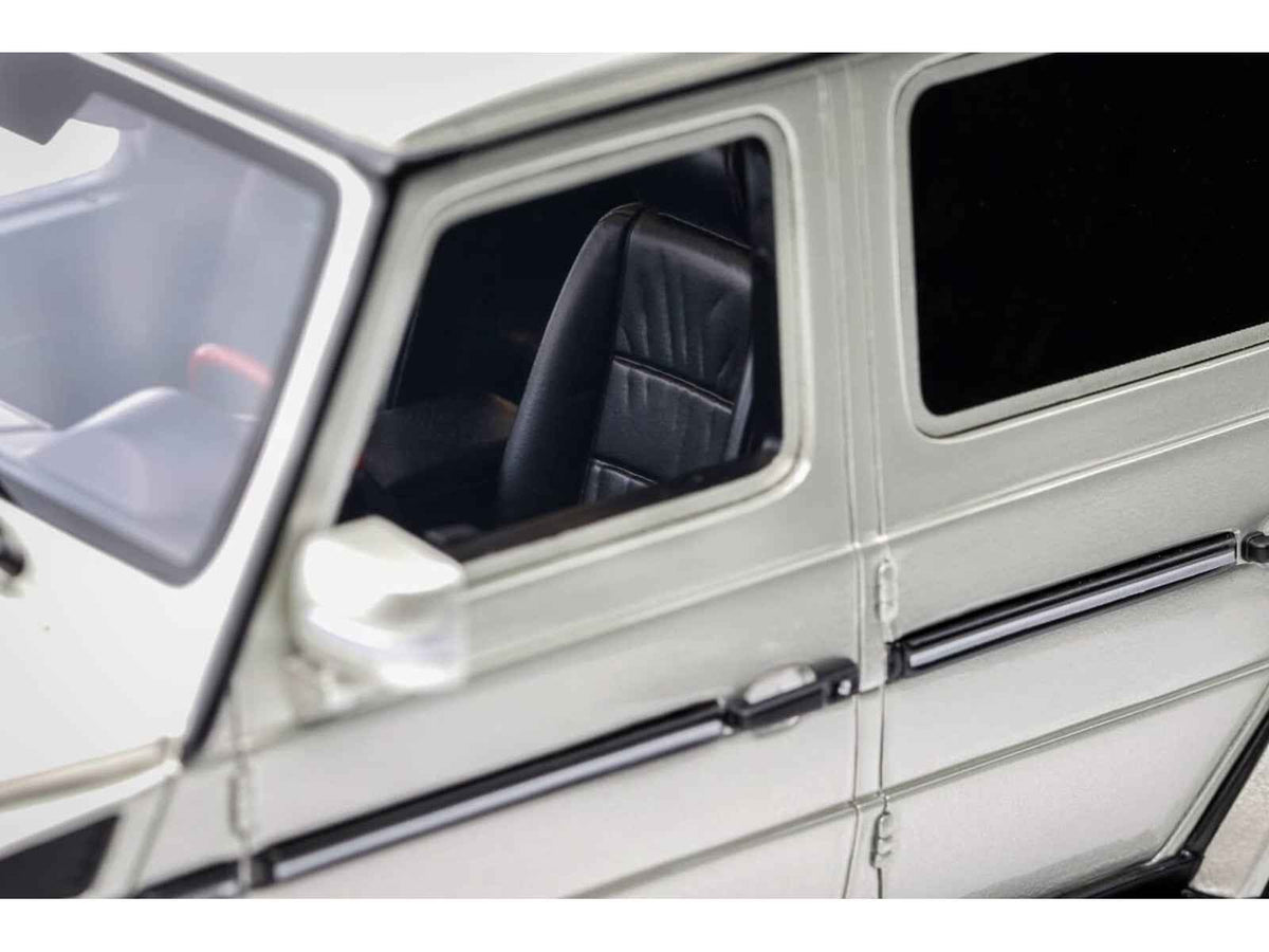 Miniature Mercedes-Benz G-Class 55 AMG 1/18 model car in Iridium Silver Metallic by Otto Mobile, limited edition collectible.