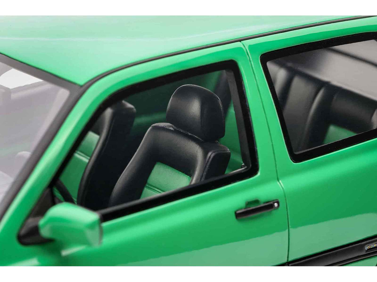 Miniature 1/18 Volkswagen Golf III GTI Salsa Green model car by Otto Mobile, detailed replica from 1995 Volkswagen Golf series.