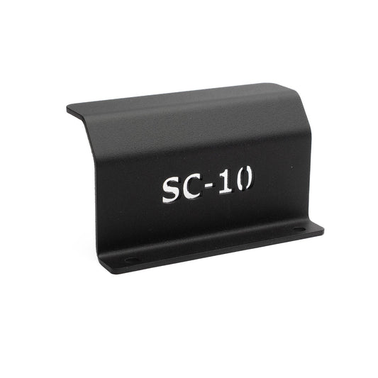 MeLe Antigravity SC-10 Supercharger wall mount for battery accessories, shown attached to a wall with cables connected.