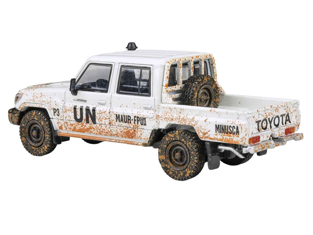 White 2014 Toyota Land Cruiser LC 79 pickup truck diecast model by Miniature Motors, detailed 1/64 scale "UN MINUSCA" version.